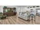 Spacious living room featuring wood-look floors, stylish decor, and an open layout perfect for relaxation and entertaining at 707 Butter Rd, Bonneau, SC 29431