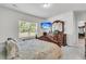 Serene main bedroom with a comfortable bed, ample natural light, and neutral tones, creating a peaceful retreat at 707 Butter Rd, Bonneau, SC 29431