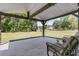 Covered patio area with a beautiful green backyard, perfect for outdoor relaxation at 707 Butter Rd, Bonneau, SC 29431