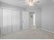 Bright bedroom with neutral paint, carpet flooring, and closet space offers a clean and inviting space at 715 Majestic Oak Dr, Charleston, SC 29412