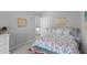 Comfortable bedroom with neutral walls, carpet flooring, and coastal themed decorations at 715 Majestic Oak Dr, Charleston, SC 29412