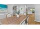 Light-filled dining room featuring an expansive wooden dining table and seating for six at 715 Majestic Oak Dr, Charleston, SC 29412
