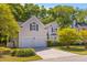 Charming two-story home featuring an attached two car garage and well-manicured front yard at 715 Majestic Oak Dr, Charleston, SC 29412