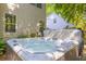 Relaxing backyard hot tub with jets in a private backyard setting at 715 Majestic Oak Dr, Charleston, SC 29412