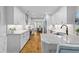 Bright kitchen features white cabinets, stainless steel appliances, and hardwood floors at 715 Majestic Oak Dr, Charleston, SC 29412