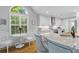 Bright breakfast nook flows into the kitchen featuring stone countertops and modern appliances at 715 Majestic Oak Dr, Charleston, SC 29412