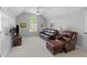 Cozy living room boasting vaulted ceilings, plush leather furniture, and carpeted floors at 715 Majestic Oak Dr, Charleston, SC 29412