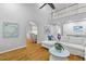 Open concept living area with views into the kitchen, hardwood floors, and a comfortable white sofa at 715 Majestic Oak Dr, Charleston, SC 29412