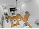 Open-concept living room with hardwood floors, fireplace, and large windows provides a modern and airy atmosphere at 715 Majestic Oak Dr, Charleston, SC 29412