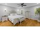 A calming main bedroom with hardwood floors, ceiling fan, and soft natural light at 715 Majestic Oak Dr, Charleston, SC 29412