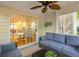 Inviting covered patio with comfortable seating and a view of the lush backyard offers a perfect outdoor retreat at 715 Majestic Oak Dr, Charleston, SC 29412