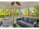 Relaxing screened porch with comfortable seating and view of trees provides a serene outdoor living space at 715 Majestic Oak Dr, Charleston, SC 29412