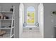 Cozy window seat with built-in shelving and coastal decor offers a relaxing retreat with plenty of natural light at 715 Majestic Oak Dr, Charleston, SC 29412