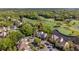 Beautiful aerial view showcasing a property next to a lush golf course and tranquil pond at 732 Spinnaker Beachhouse, Seabrook Island, SC 29455