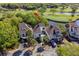 Beautiful elevated angle of the condo showing landscaping, updated roof, and stunning golf course and water views at 732 Spinnaker Beachhouse, Seabrook Island, SC 29455