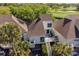 Aerial view of a home with a spacious deck overlooking a lush green golf course and a serene body of water at 732 Spinnaker Beachhouse, Seabrook Island, SC 29455