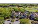 Aerial view of the house situated amongst lush greenery with golf course and water views, providing a sense of serenity at 732 Spinnaker Beachhouse, Seabrook Island, SC 29455