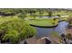 Picturesque aerial view of a home nestled beside a golf course and a tranquil water feature, highlighting the property's location at 732 Spinnaker Beachhouse, Seabrook Island, SC 29455