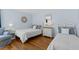 Bright bedroom with pale blue walls, hardwood floors, two beds, and coordinated decor at 732 Spinnaker Beachhouse, Seabrook Island, SC 29455