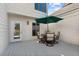 Relax or entertain outdoors on this deck featuring a dining table and umbrella, great for any time of day at 732 Spinnaker Beachhouse, Seabrook Island, SC 29455