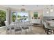 Charming dining room with a view of the water, a white table set, and a buffet at 732 Spinnaker Beachhouse, Seabrook Island, SC 29455