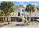 Charming stilted home boasts updated siding and trim and is framed by mature palms and landscaped grounds at 732 Spinnaker Beachhouse, Seabrook Island, SC 29455