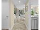 View of the beautiful hallway showcasing views to the living area and featuring tile floors and neutral paint at 732 Spinnaker Beachhouse, Seabrook Island, SC 29455