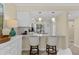 Kitchen bar seating area with granite countertops, pendant lighting, and bar stools at 732 Spinnaker Beachhouse, Seabrook Island, SC 29455