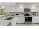 Bright kitchen with stainless steel appliances, granite countertops, and ample cabinet space at 732 Spinnaker Beachhouse, Seabrook Island, SC 29455