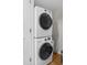 Convenient laundry area with stacked washer and dryer units, providing efficiency and space-saving design at 732 Spinnaker Beachhouse, Seabrook Island, SC 29455