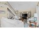 Bright living room with staircase, open layout, and plenty of natural light at 732 Spinnaker Beachhouse, Seabrook Island, SC 29455