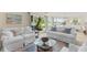 Inviting living room with water views, comfortable couches, and a cozy atmosphere at 732 Spinnaker Beachhouse, Seabrook Island, SC 29455