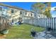Lush backyard featuring green lawn, patio with grill, and fenced-in privacy at 853 Bibury Ct, Charleston, SC 29414