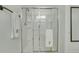 Bright bathroom featuring a glass-enclosed shower with a white towel hanging on the door at 853 Bibury Ct, Charleston, SC 29414