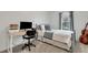 Bright bedroom with a gray bed, desk with computer, and natural light at 853 Bibury Ct, Charleston, SC 29414