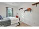Inviting bedroom with guitar, cello, and floating shelves adding character at 853 Bibury Ct, Charleston, SC 29414