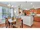 Cozy dining room with a large window for natural light adjacent to the kitchen at 853 Bibury Ct, Charleston, SC 29414