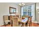 Comfortable dining room with wood floors and a stylish mirror above the buffet at 853 Bibury Ct, Charleston, SC 29414