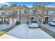 Charming townhome with a stone facade, attached garage, and long driveway at 853 Bibury Ct, Charleston, SC 29414