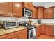 Modern kitchen with granite counters, stainless appliances, and ample cabinet space at 853 Bibury Ct, Charleston, SC 29414