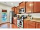 Updated kitchen with stainless steel appliances and granite countertops; door to backyard at 853 Bibury Ct, Charleston, SC 29414