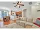 Bright open-concept living room with hardwood floors flowing into the dining and kitchen at 853 Bibury Ct, Charleston, SC 29414