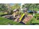 Community playground with multiple slides, swings, and climbing structures at 853 Bibury Ct, Charleston, SC 29414