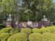 Elegant 'Hunt Club' sign with brick pillars and manicured greenery at 853 Bibury Ct, Charleston, SC 29414