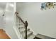 The stairway features carpeted steps, a wooden handrail, and white painted risers at 853 Bibury Ct, Charleston, SC 29414