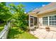 Lovely backyard with a tiled patio and a charming white picket fence at 8652 Grassy Oak Trl, North Charleston, SC 29420