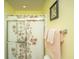 Neutral bathroom with shower featuring patterned curtain, and decorative framed art at 8652 Grassy Oak Trl, North Charleston, SC 29420