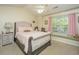 Bedroom features neutral walls, ceiling fan, and window bench at 8652 Grassy Oak Trl, North Charleston, SC 29420