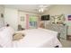 Bedroom features neutral walls, ceiling fan, and view of green trees through the window at 8652 Grassy Oak Trl, North Charleston, SC 29420