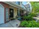 Up-close view of the front porch with stylish decorations and seating area at 8652 Grassy Oak Trl, North Charleston, SC 29420